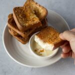 Sviestas Tteok (sviestinis ryžių pyragas) – auksinė pluta, kramtomas centras